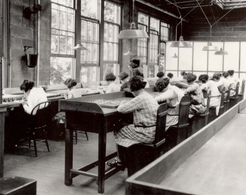 Figure 6: To paint the tiny hands of a wristwatch, dial painters in this factory would create a perfect, fine tip for this delicate work by touching the poisoned paint to their lips.
